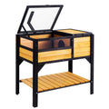 Cedar tortoise house on a stand with the lid open