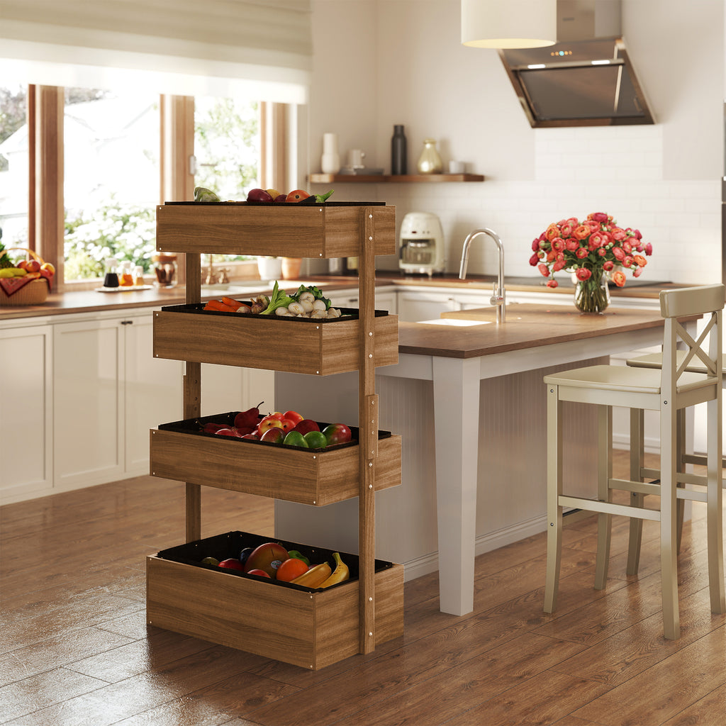 The four-tier wooden planter standing in a bright kitchen with vegetables and peppers in its boxes