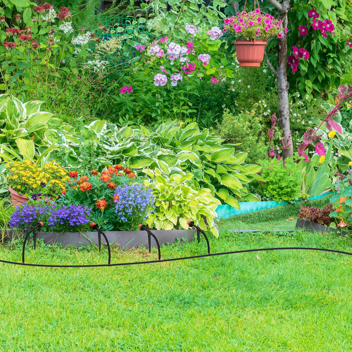 Drip line watering a planted garden bed