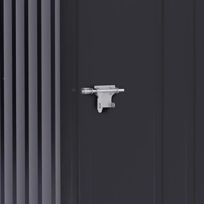 Close view of the sliding steel latch on the shed's dark corrugated door, ready to take a padlock