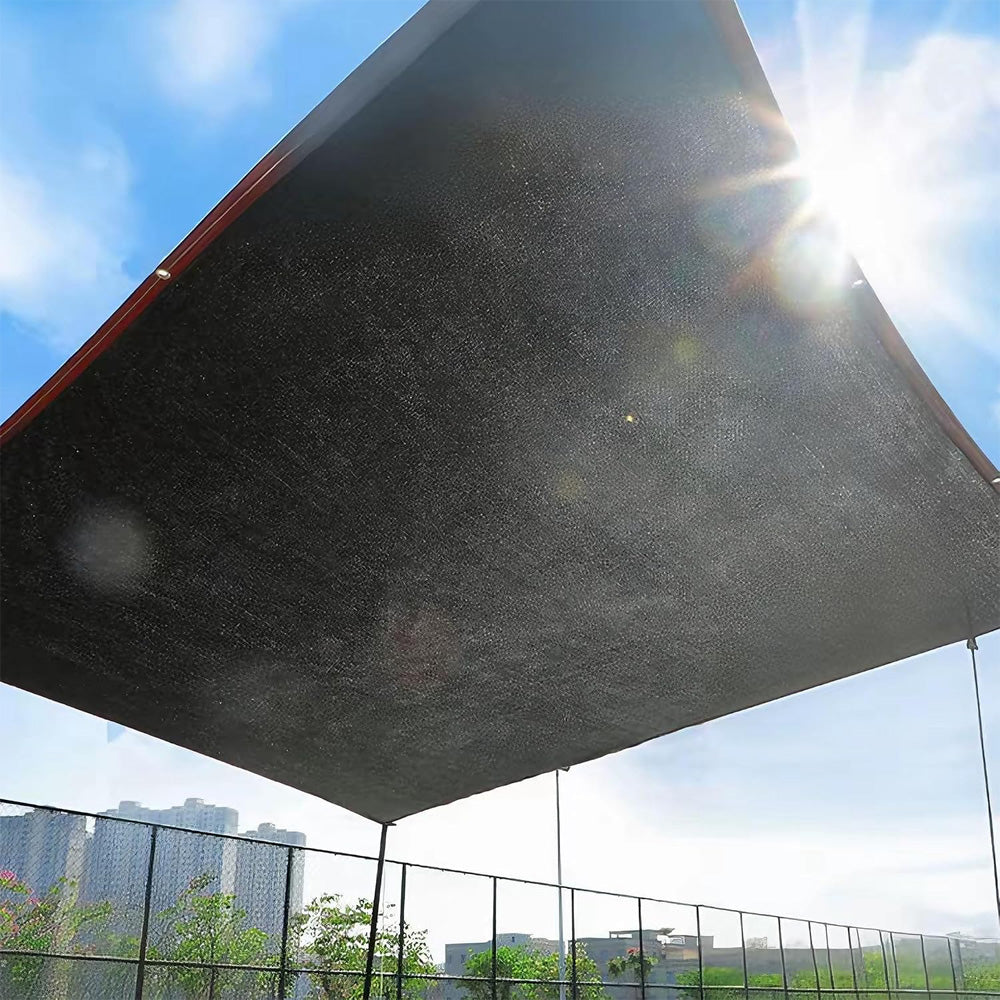 Shade cloth stretched overhead with sunlight through the knit