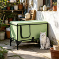 Heated cat house on an elevated stand on a patio