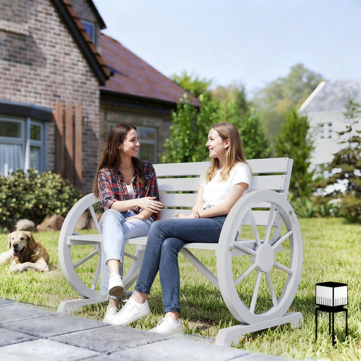 The light gray wagon wheel bench on a lawn