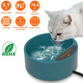 Cat drinking from the heated pet water bowl