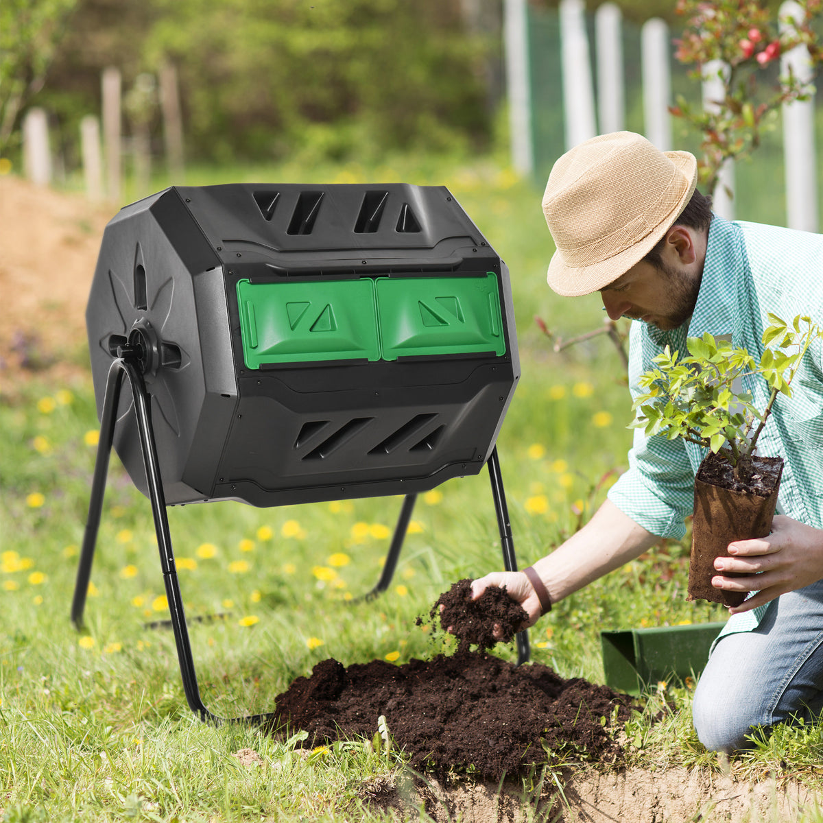 Gardener emptying finished compost from the tumbler