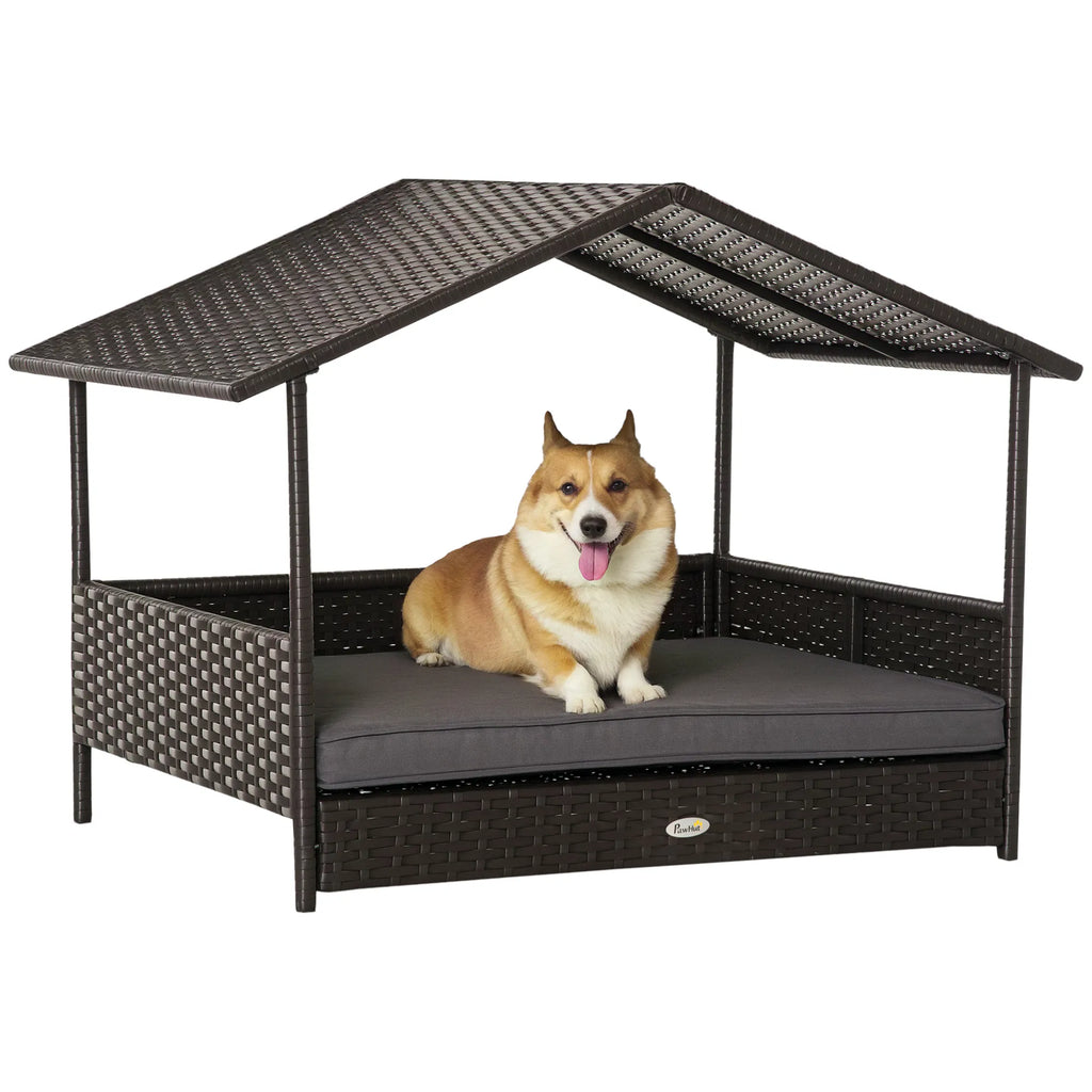 Dog resting on a wicker pet bed with a canopy