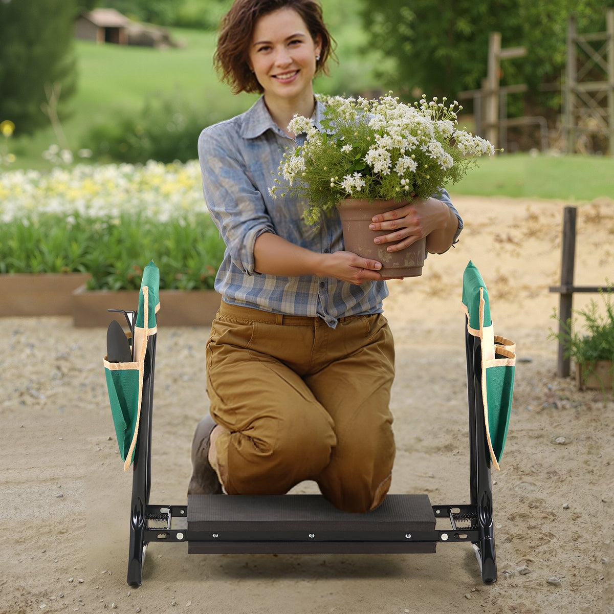 Gardener kneeling on the folding garden kneeler