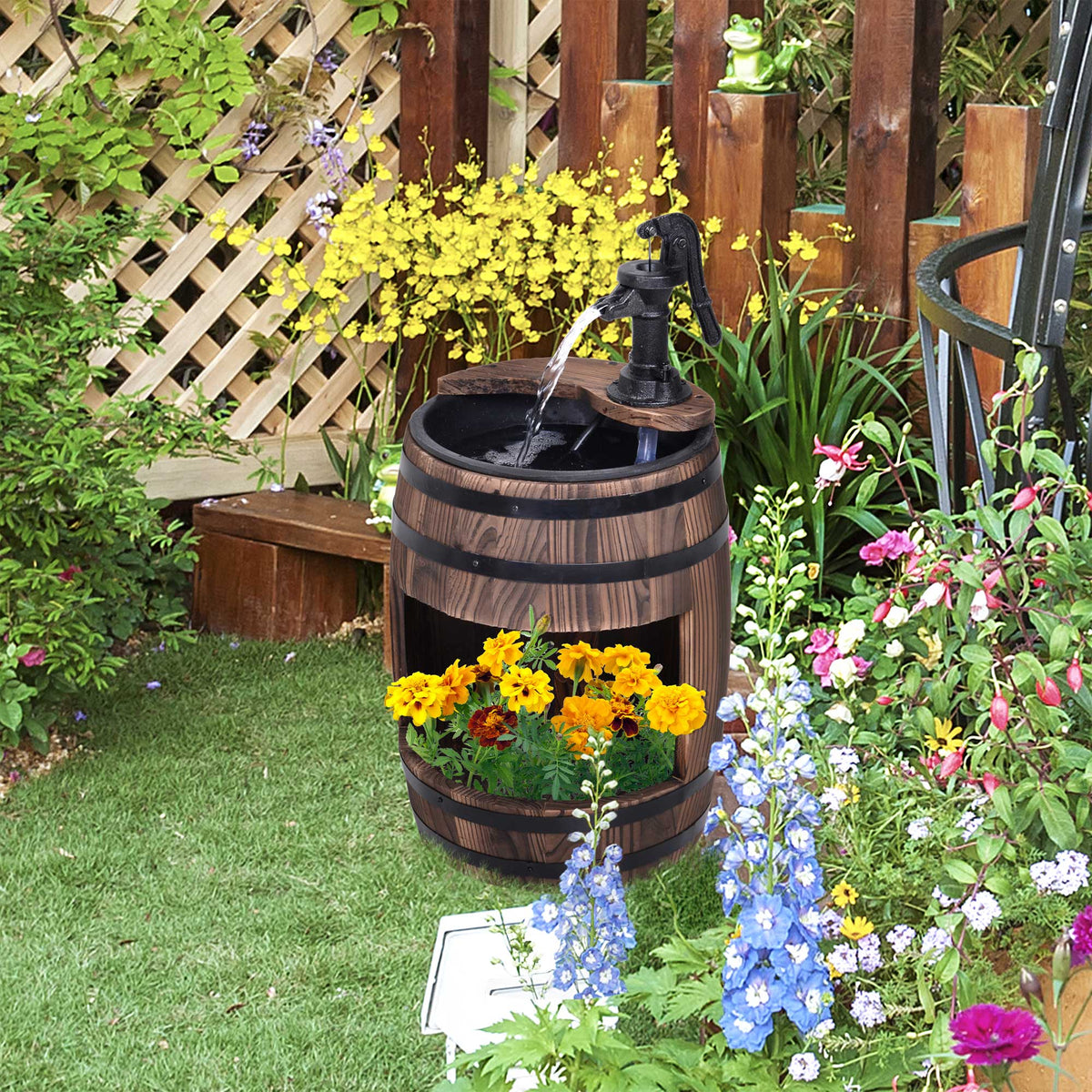 Apple barrel fountain running beside a planted border