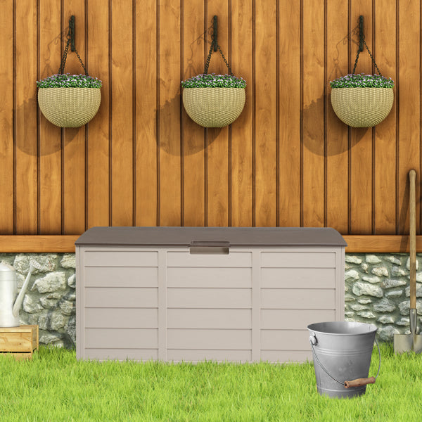 The deck box on grass in front of a wood fence hung with three planters, a metal bucket alongside