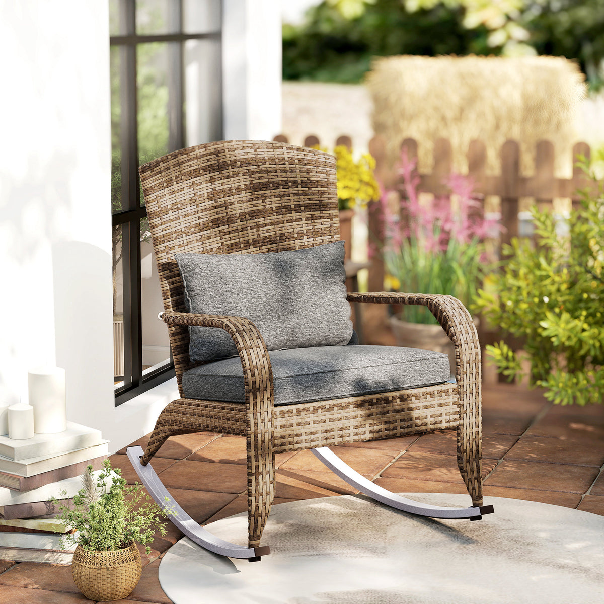 Rocking chair outdoors beside planted borders