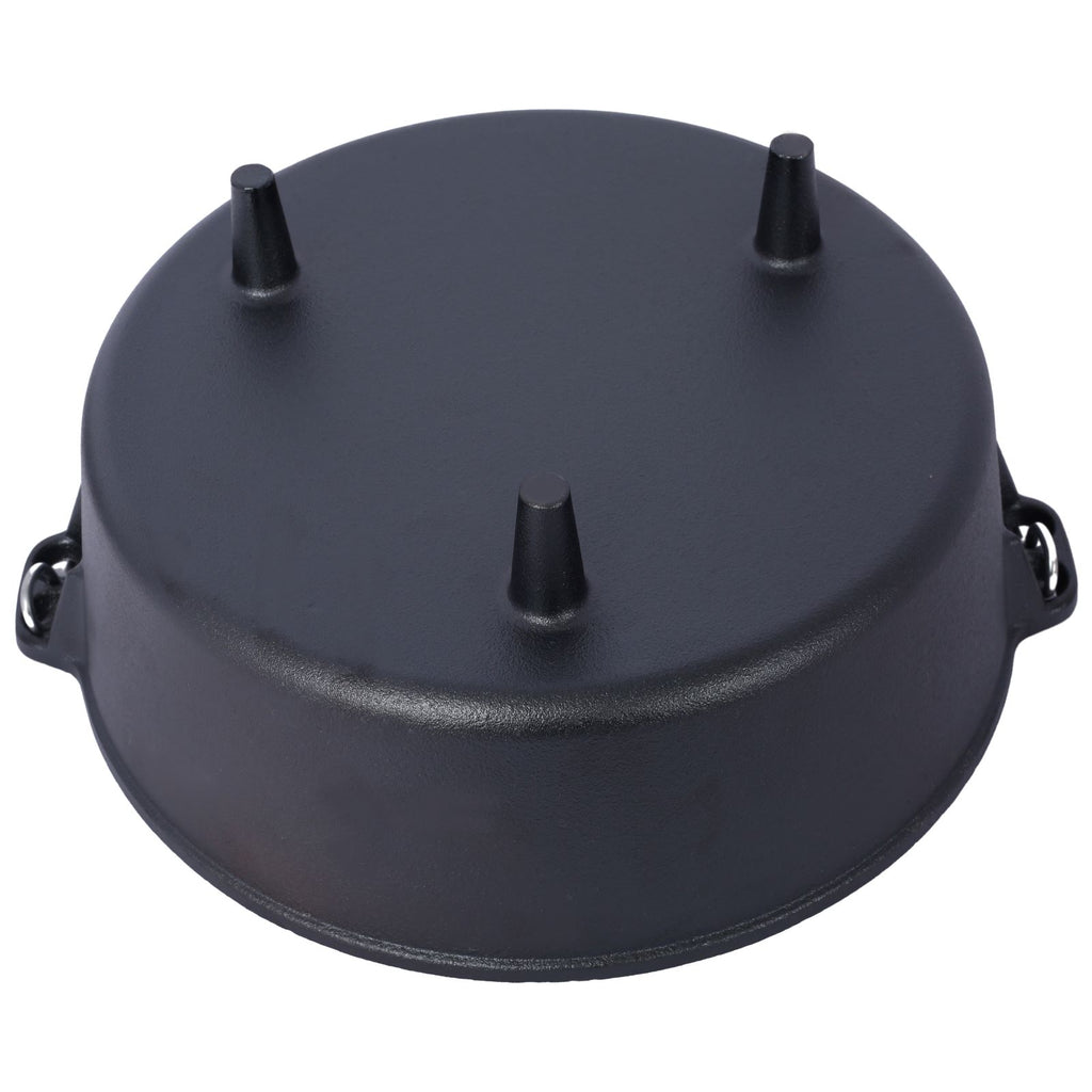Bottom of the pot showing the three short legs and the loop handles on each side