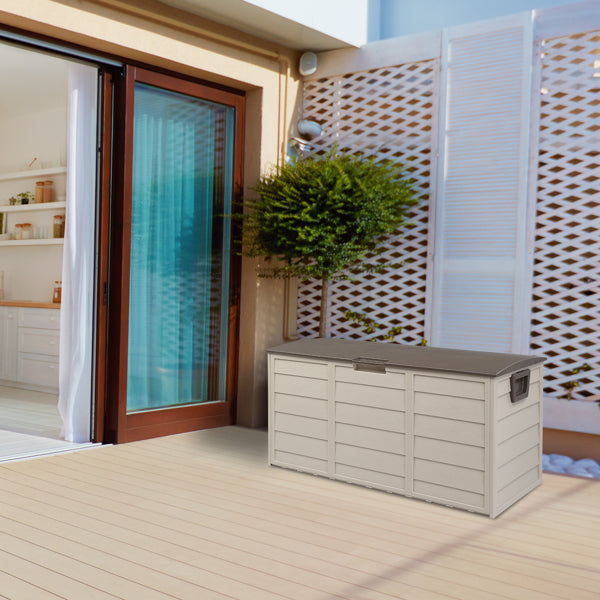 The deck box on a wooden patio next to sliding glass doors and a potted shrub