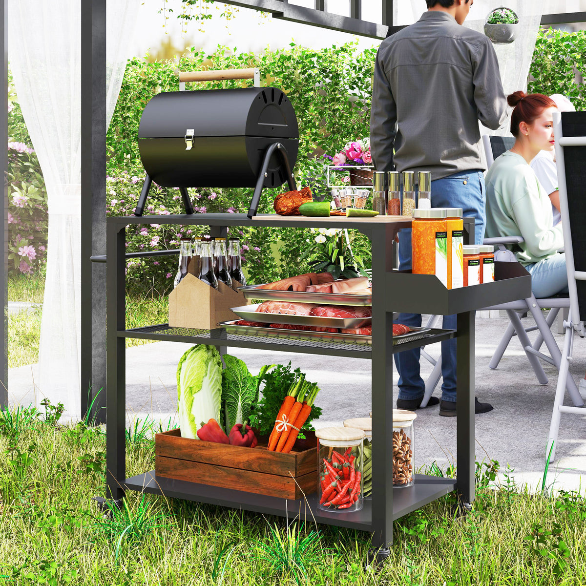 The grill cart in use beside a barrel smoker, loaded with vegetables in a crate and bottles on the top shelf