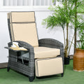 Reclining wicker lounge chair on a patio beside a plant