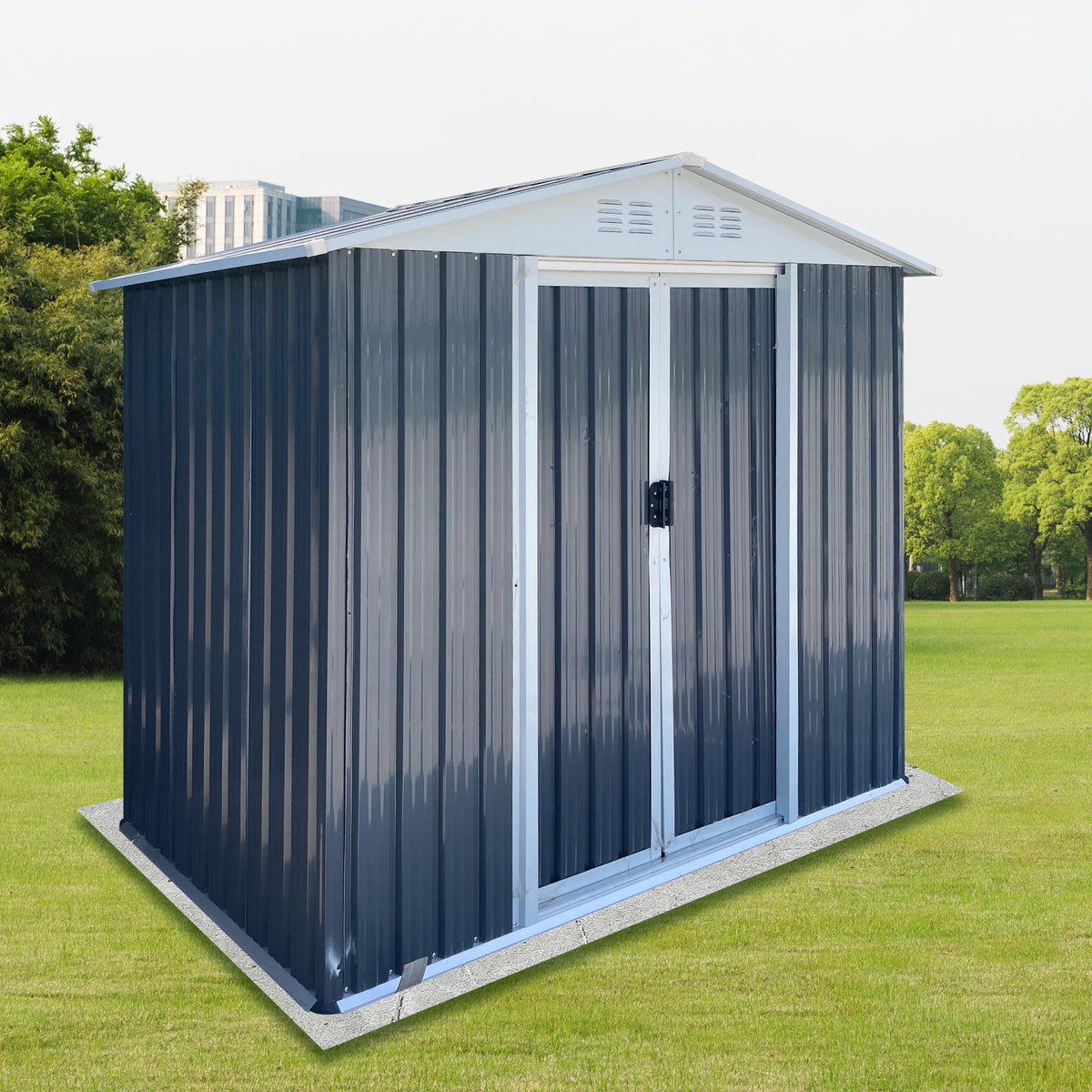 Grey metal storage shed with white sliding doors standing on a lawn, seen from an angle