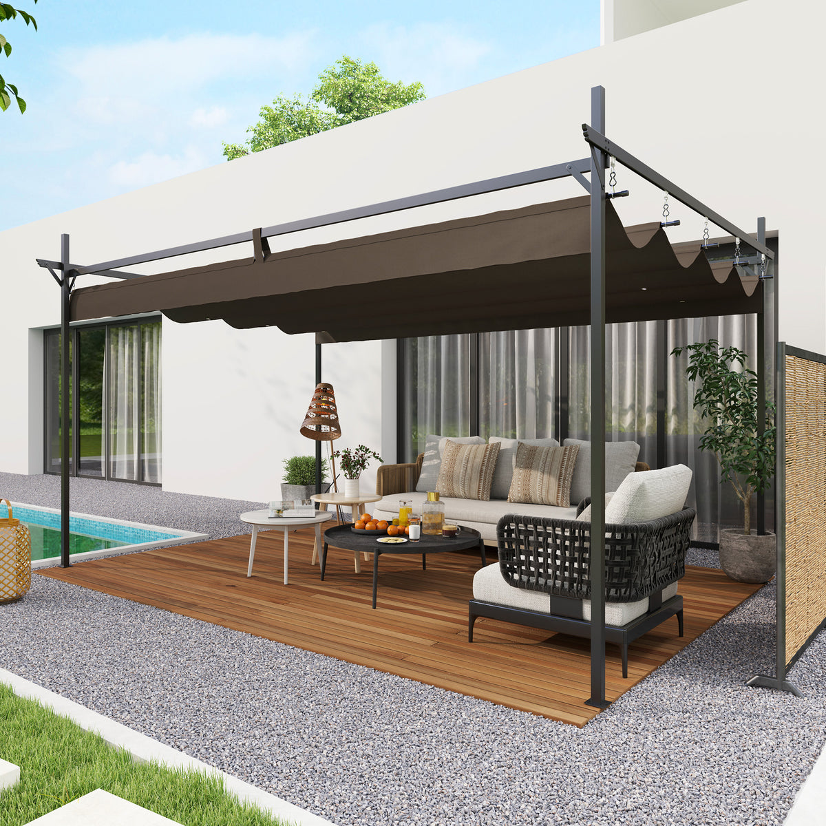 The pergola shading a seating area in a gravelled courtyard