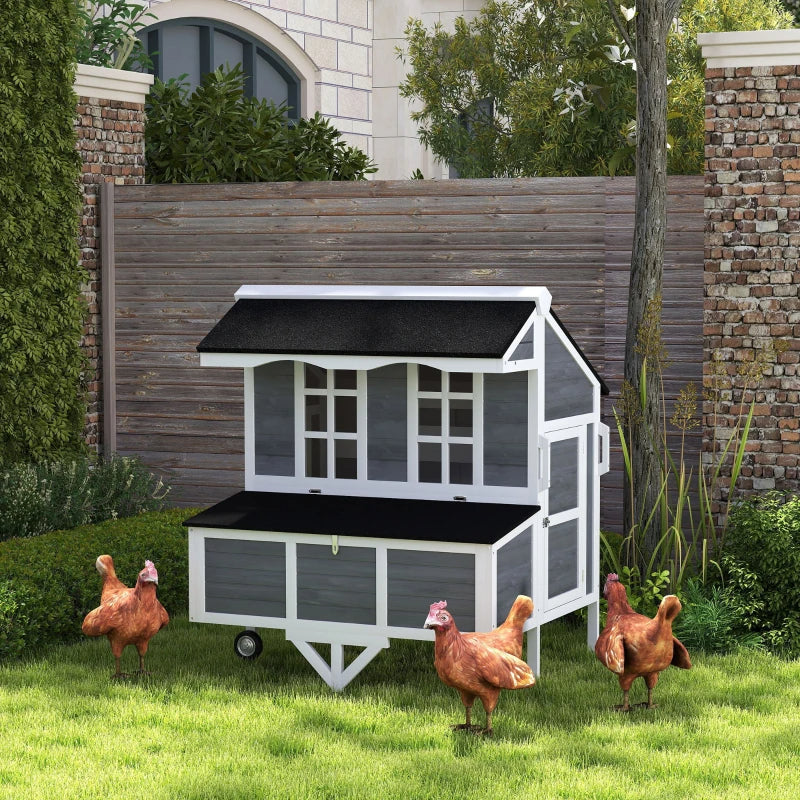 Hens beside the mobile coop in a garden