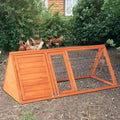 A-frame wooden rabbit hutch on a garden path