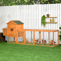 Extra large wooden chicken coop with attached run in a yard
