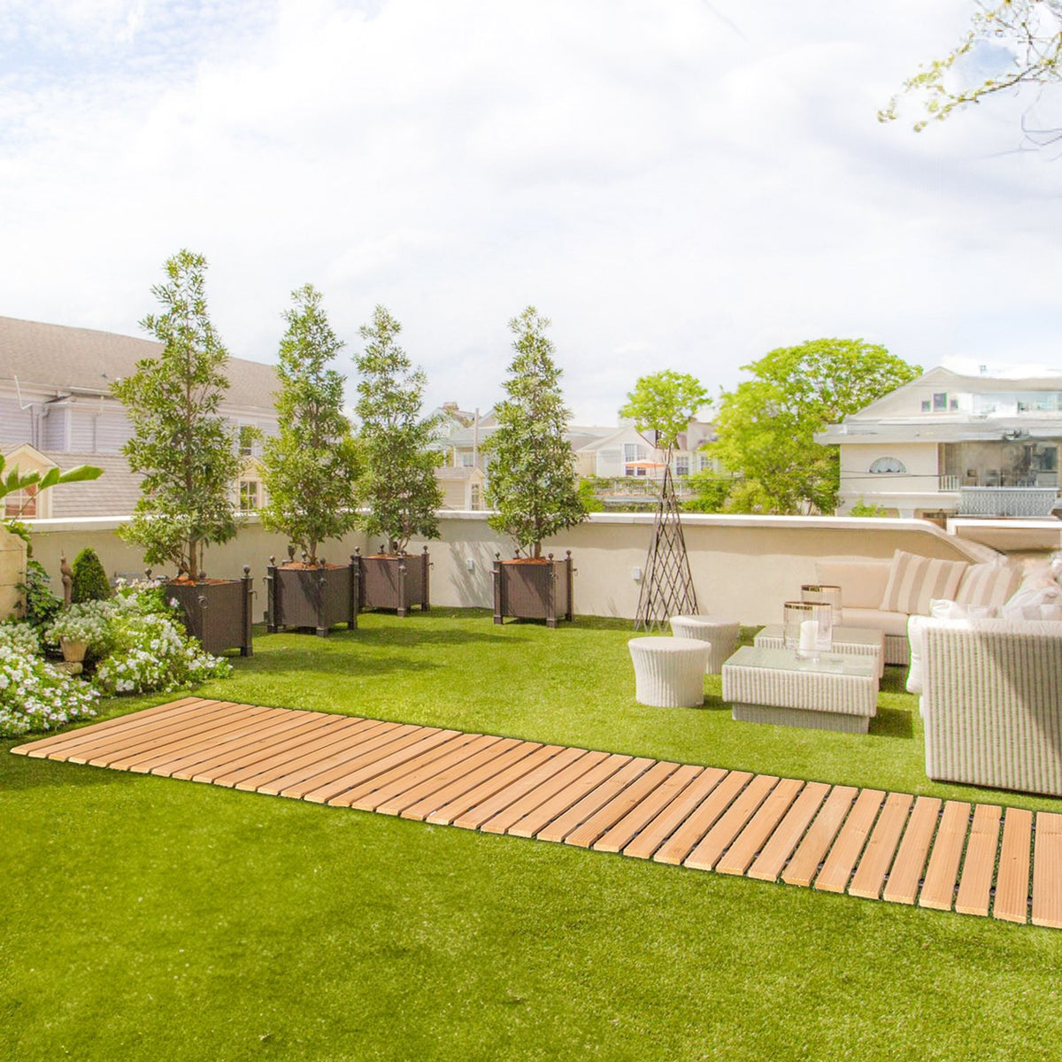 Wooden roll-out pathway laid across a lawn