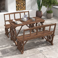 Wagon wheel table and two benches set for a meal on a patio